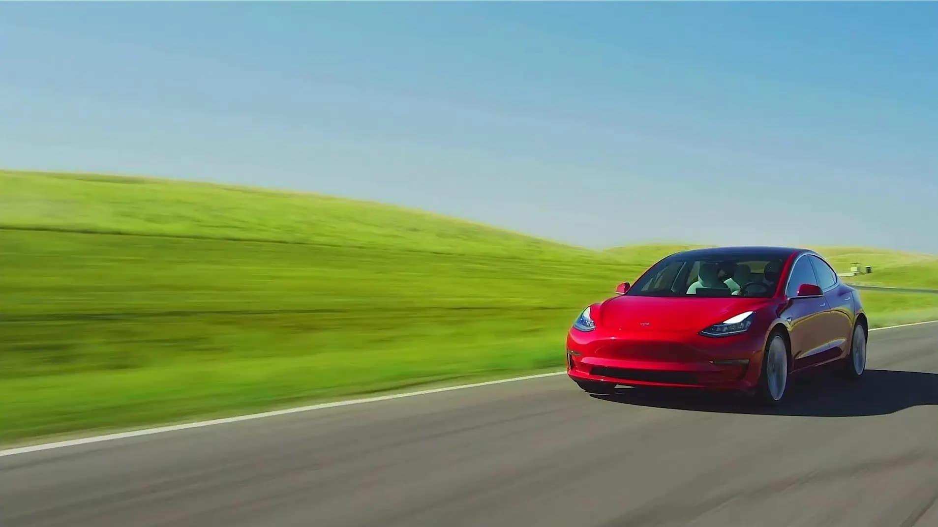 Eco-friendly car driving on a scenic road
